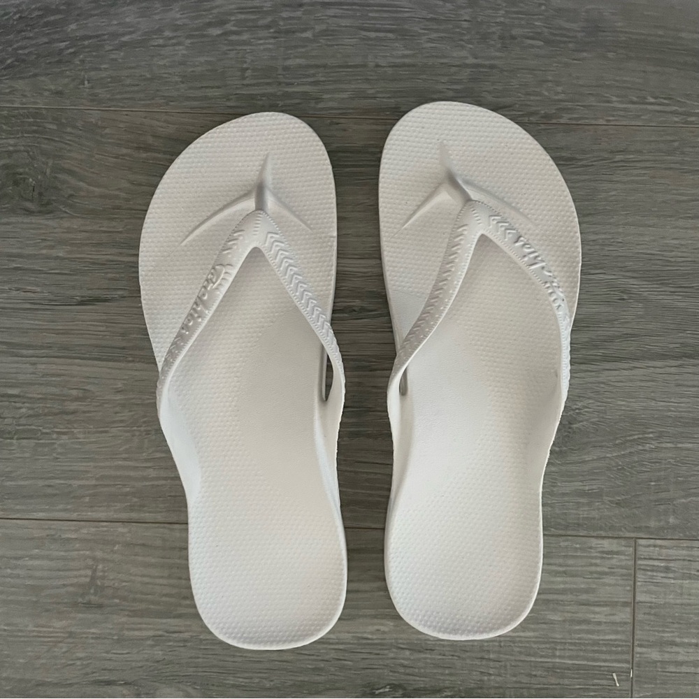 NWOT Archies white flip flops
